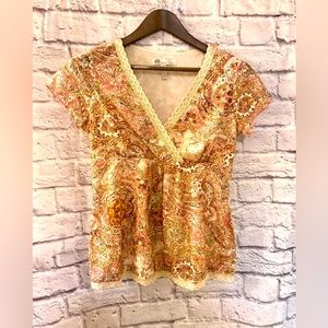 Blouse with lace and gold accents